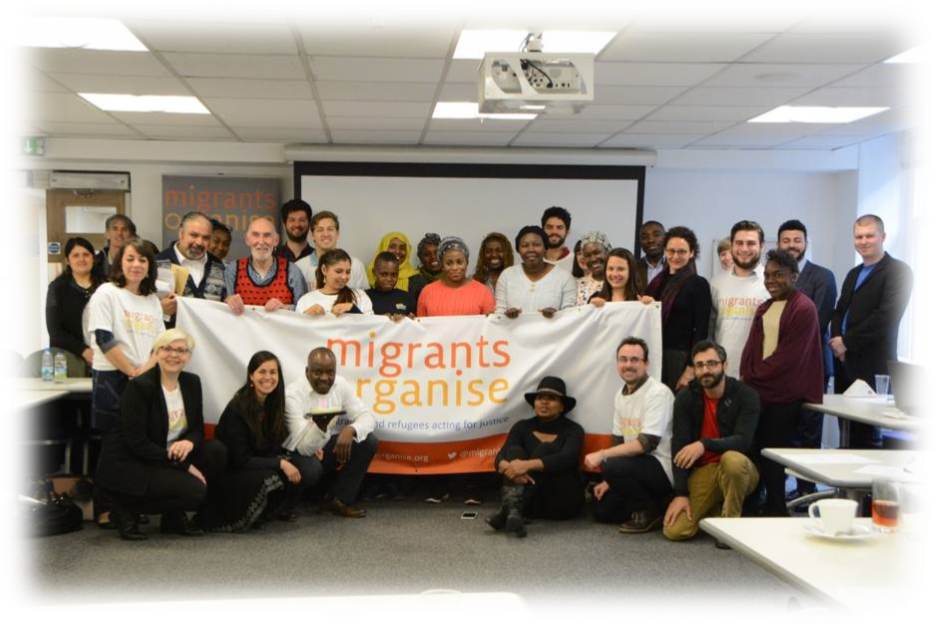 Migrant Action group holding migrants organise sign